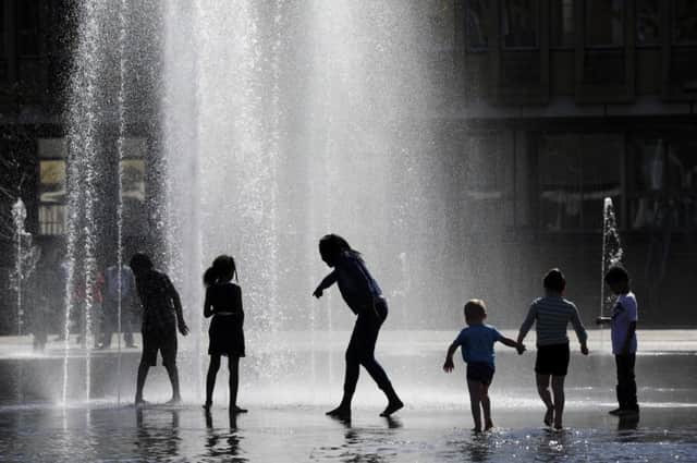 Children playing in the fountains in City Park, Centenary Square, Bradford, on Easter Monday. 
Picture: Bruce Rollinson