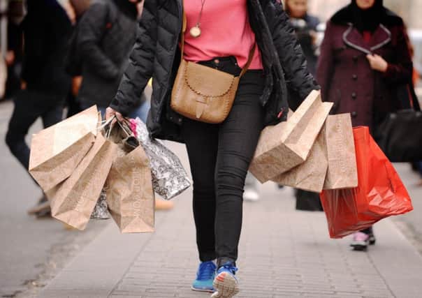Shopping spree: Consumers expected to increase their spending as prices fall.