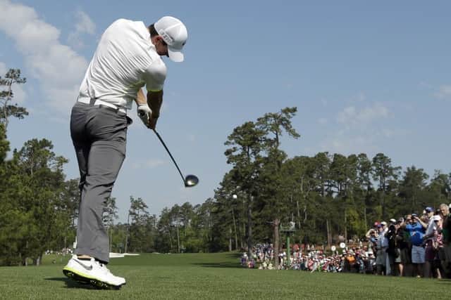 Rory McIlroy tees off on the third.