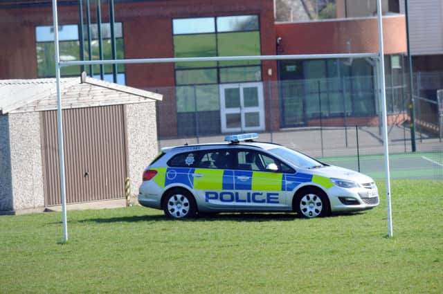 Police at the scene of the attack near the playing fields of King James's School, Knaresborough