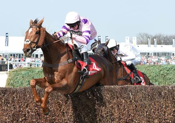 Silviniaco Conti ridden by Noel Fehily clears the final fence to win The Betfred Bowl Steeple Chase from Holywell (right) ridden by Tony McCoy