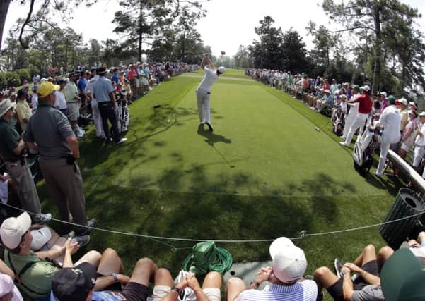 Englishman Justin Rose tees off at the ninth hole at Augusta National yesterday during the first round of the Masters (Picture: Charlie Riedel/AP).