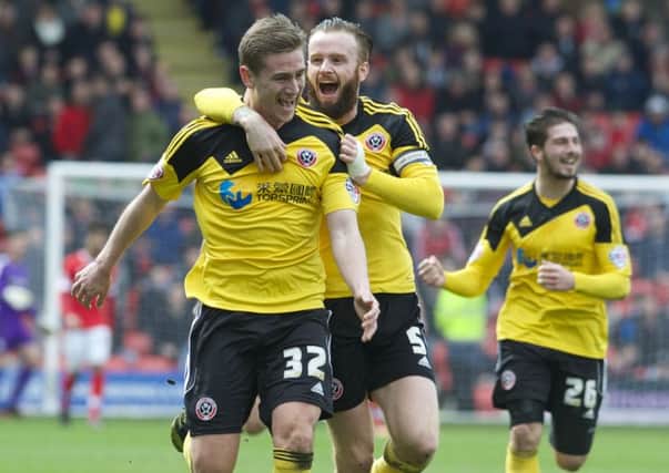 Steven Davies celebrates after putting Sheffield United ahead at Oakwell. (Picture: Dean Atkins)
