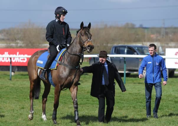 Tony McCoy chats to trainer Jonjo O'Neill after exercising Grand National runner Shutthefrontdoor at Southwell