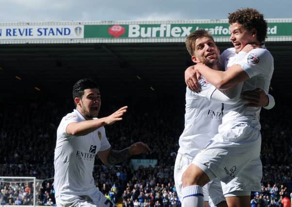 Leeds 
United's Kalvin Phillips celebrates scoring on his home debut, with Charlie Taylor and Alex Mowatt. 
(Picture: Jonathan Gawthorpe)