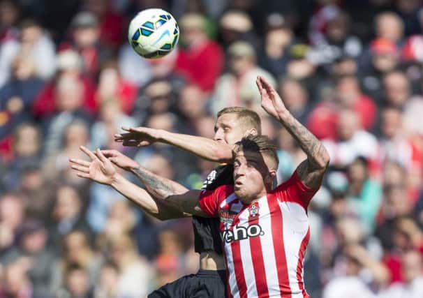 Hull City's Michael Dawson in action against Southampton's Toby Alderweireld