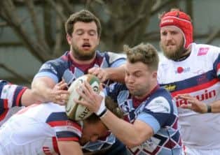 Michael Keating of Rotherham Titans tries to break through the Doncaster Knights tacklers. (GL1005/56g)