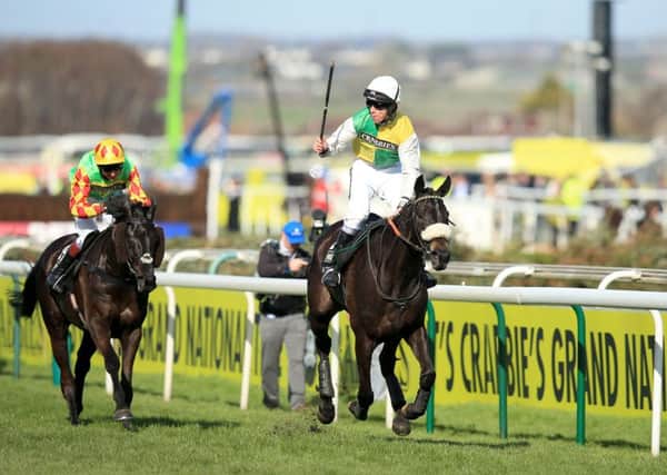 SAME AGAIN: Jockey Leighton Aspell celebrates on board Many Clouds after victory in the Grand National. Picture: Mike Egerton/PA.
