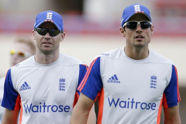 England's captain Alistair Cook , right, and teammate James Anderson leave the field after a fielding practice at the Sir Vivian Richards Cricket Ground in St. John's, Antigua. (AP Photo/Ricardo Mazalan)