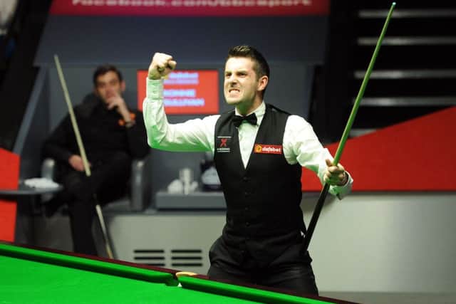 Mark Selby celebrates after winning the final of the Dafabet World Snooker Championships at The Crucible, Sheffield.