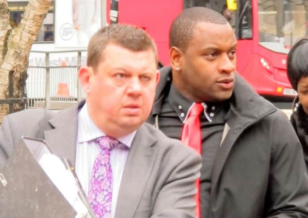 Former Hull City striker Delroy Facey (right) arrives at Birmingham Crown Court for the start of his trial accused of involvement in a match-fixing conspiracy.