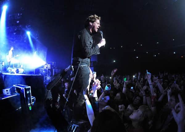 Ricky Wilson of the Kaiser Chiefs performing at the Leeds Arena