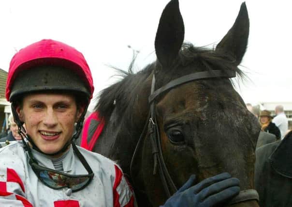 Jockey Keith Mercer with Joes Edge after winning the Gala Casinos Daily Record Scottish Grand National at Ayr racecourse, Saturday April 16, 2005. (Picture: Maurice McDonald/PA)