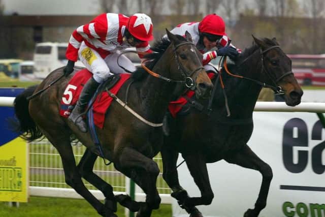 Joes Edge and jockey Keith Mercer (R) holds on to win from Cornish Rebel and jockey Ruby Walsh in the Gala Casinos Daily Record Scottish Grand National at Ayr racecourse, Saturday April 16, 2005. (Picture: Maurice McDonald/PA)