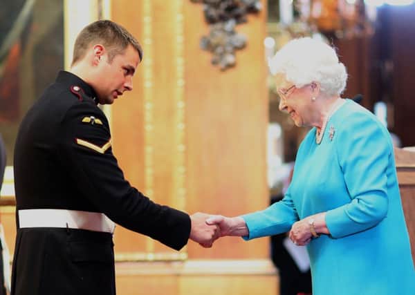 Lance Corporal Joshua Leakey being awarded a Victoria Cross by the Queen