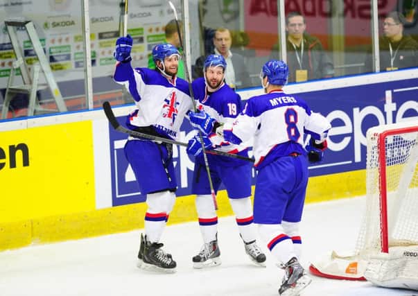 Robert Farmer, Colin Shields and Matthew Myers celebrate the game-winning goal against Estonia for great Britain in Eindhoven. Picture: Colin Lawson.