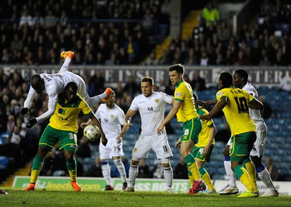 Sol Bamba is about to tumble to earth after challenging Sebastien Bassong during Leds Uniteds home defeat to Norwich City (Picture: Bruce Rollinson).