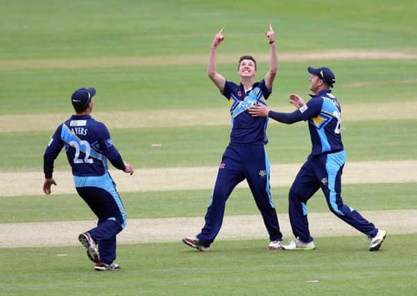 ON THE UP: Matthew Fisher celebrates his first professional wicket with Joe Sayers and captain Andrew Gale back in June 2013.