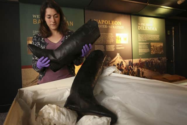 Sarah Lambarth, an English Heritage Collections Conservator unpacking a pair of the Duke of Wellington's boots