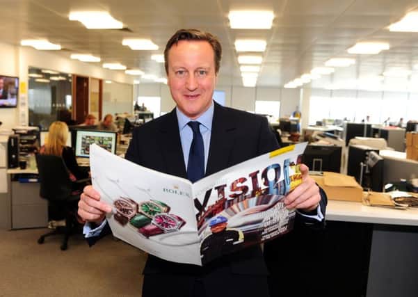 16 April 2015 .......       David Cameron on the election trail during a visit to the Yorkshire Post offices in Leeds. TJ100799h Picture Tony Johnson