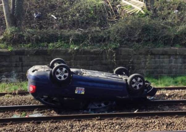 Twitter picture of the overturned car on the track at Shipley
