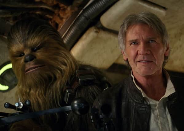 Chewbacca and Harrison Ford in a scene from Star Wars: The Force Awakens