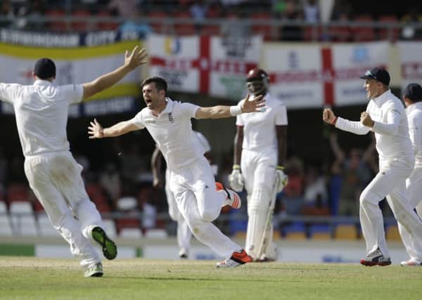 James Anderson is overjoyed after taking the wicket of the West Indies Denesh Ramdin to become Englands leading Test wicket-take (Picture: Ricardo Mazalan/AP).