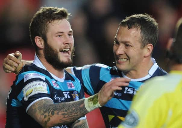 Zak Hardaker is congratulated by Danny McGuire after his try.