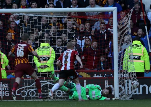 Billy Clarke nets Bradford City's late equaliser against Sheffield United (Picture: Martyn Harrison).