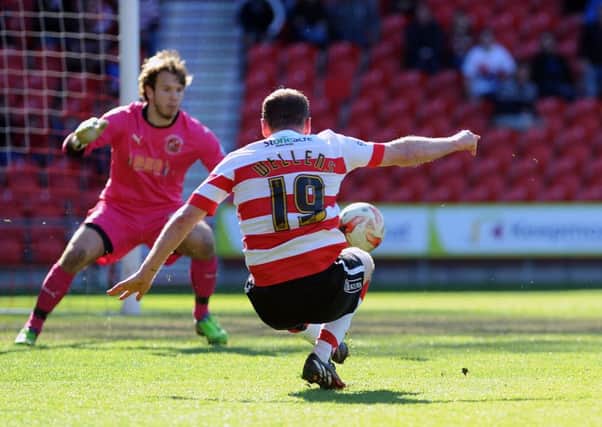 Doncaster's Richie Wellens hooks the ball goalwards. Photo: Steve Uttley.