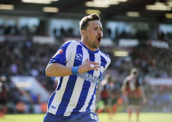 Chris Maguire celebrates his late equaliser.