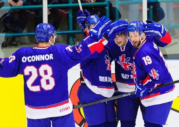 ON A ROLL: GB's players celebrate Craig Peacock's goal against hosts Netherlands in Eindhoven on Saturday. 

Picture: Colin Lawson