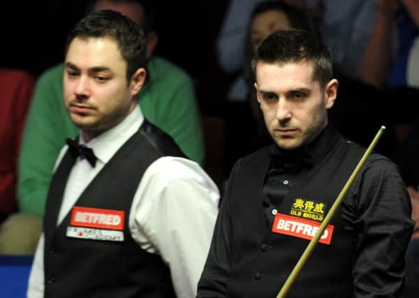 Mark Selby (right) during his match against Kurt Maflin at the Crucible.