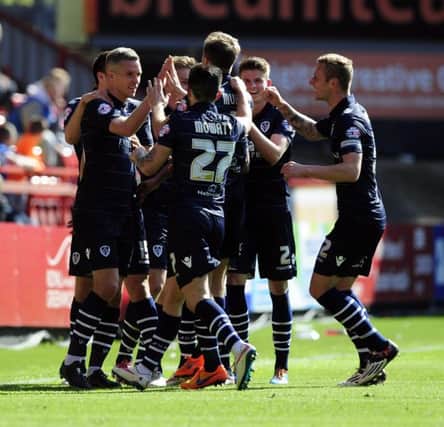 Leeds United's Steve Morison celebrates with team-mates after scoring the opening goal of the match against Charlton.