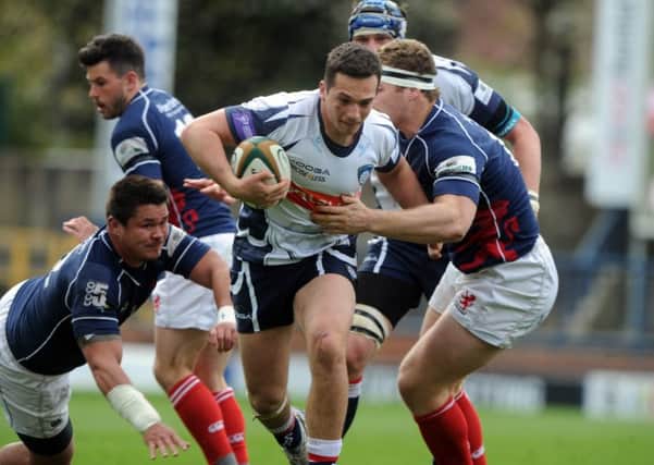 Carnegie's Pete Lucock charges at the Scottish defence. (Picture: Tony Johnson)
