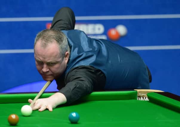 MOVING ON: John Higgins on his way to a 10-5 victory over Robert Milkins last night, a welcome return to form in Sheffield after suffering a decline in form and confidence since his 2011 world title. Picture: PA
