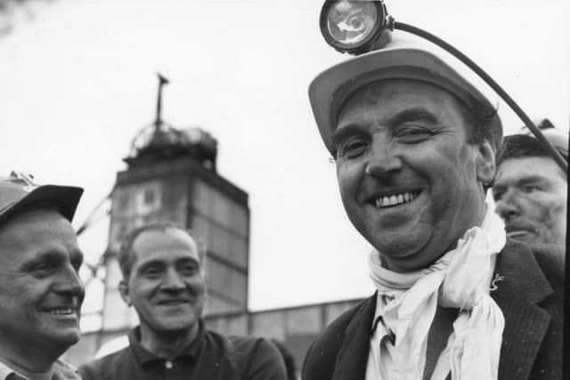 Roy Mason in miners' garb