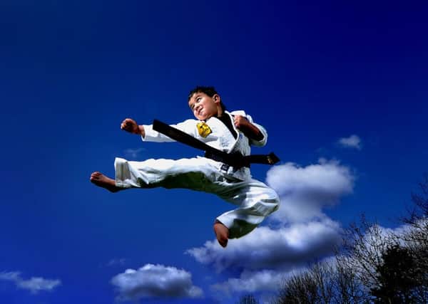 Picture James Hardisty, (JH1008/14b). Jake Frood, 6, of Meanwood, Leeds, is thought to be the youngest black belt in the world and has just gained his 2nd degree black belt in mixed martial arts.