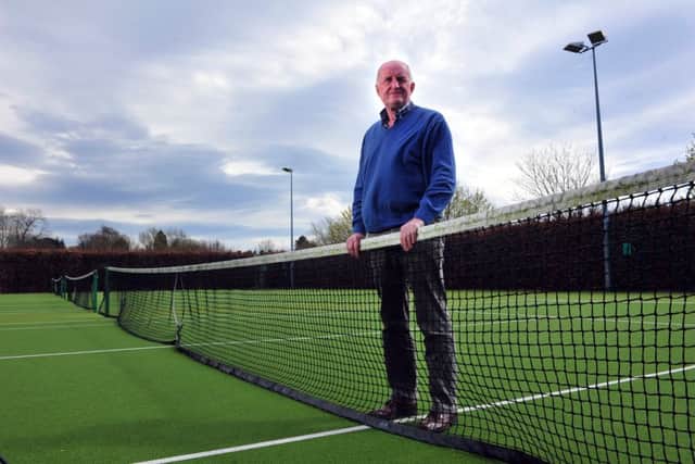 Chairman Richard Bourdon checking out the courts at what he regards as the most picturesque tennis club in the country.