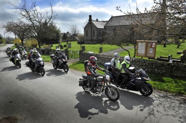 Vicars from the Diocese of West Yorkshire and the Dales Motor Cycle Club. Pictured riding past St John the Evangelist church in Bellerby.