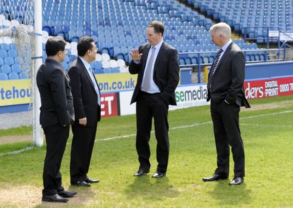 Sheffield Wednesday chairman Dejphon Chansiri seen with his new advisers Glenn Roeder, second right, and Adam Pearson, right (Picture: Steve Ellis).
