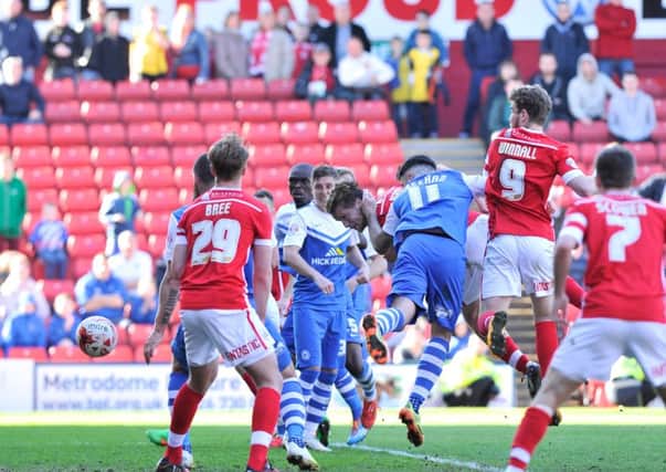 Luke Berry heads the equaliser for Barnsley in the final seconds against Peterborough (Picture: Dean Atkins).