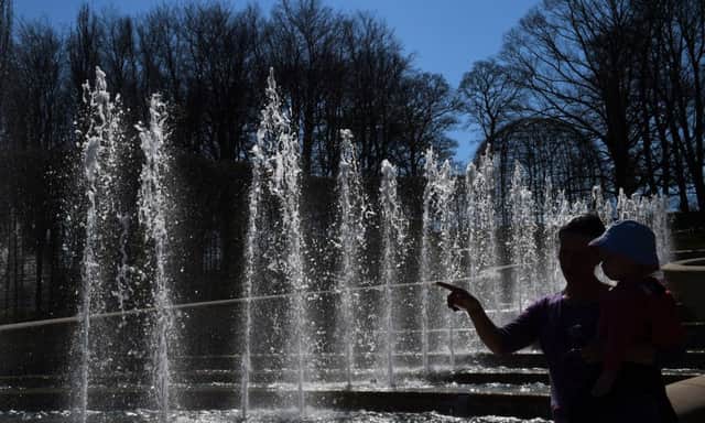 Visitors look at the fountains in Alnwick Garden in Northumberland
