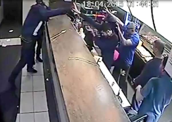 CCTV still from Imrans on the Wicker of a man who hurled chairs at the Sheffield takeaway's staff in sustained violent outburst