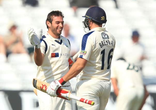 Yorkshire's Jack Leaning celebrates his century with Tim Bresnan (right).