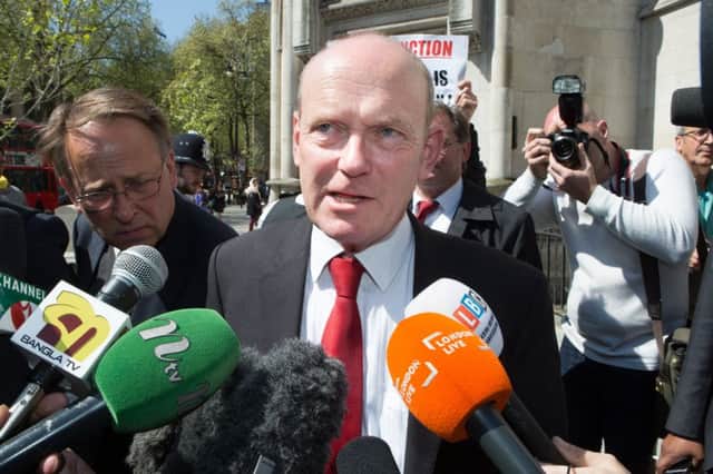 Labour's mayoral candidate for Tower Hamlets, John Biggs, speaks outside the Royal Courts of Justice in central London
