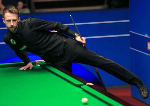 CONTENDER: Judd Trump in action against Stuart Carrington at the Crucible Theatre. Picture: : Nigel French/PA.