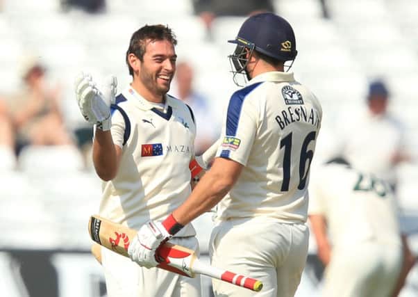 Yorkshire's Jack Leaning celebrates his century with Tim Bresnan.