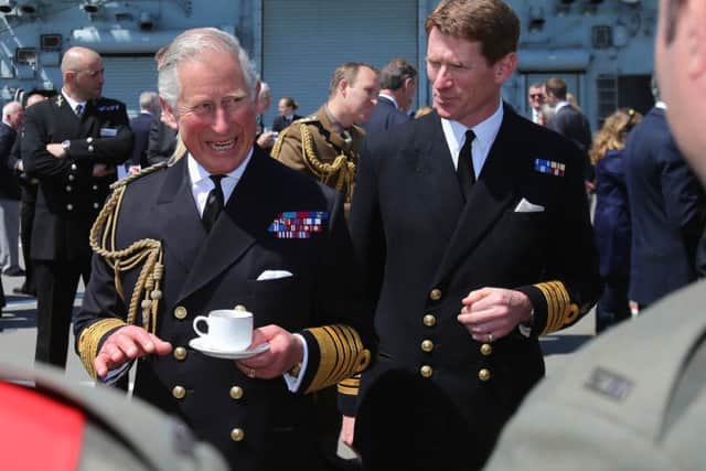 The Prince of Wales with Captain Nick Cooke-Priest during a reception on HMS Bulwark with relatives of veterans of the Gallipoli Campaign
