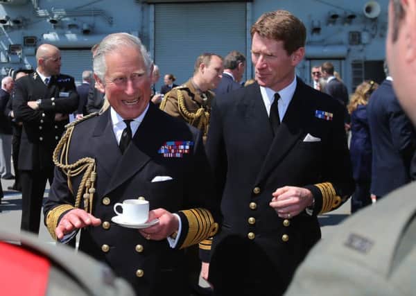 The Prince of Wales with Captain Nick Cooke-Priest during a reception on HMS Bulwark with relatives of veterans of the Gallipoli Campaign